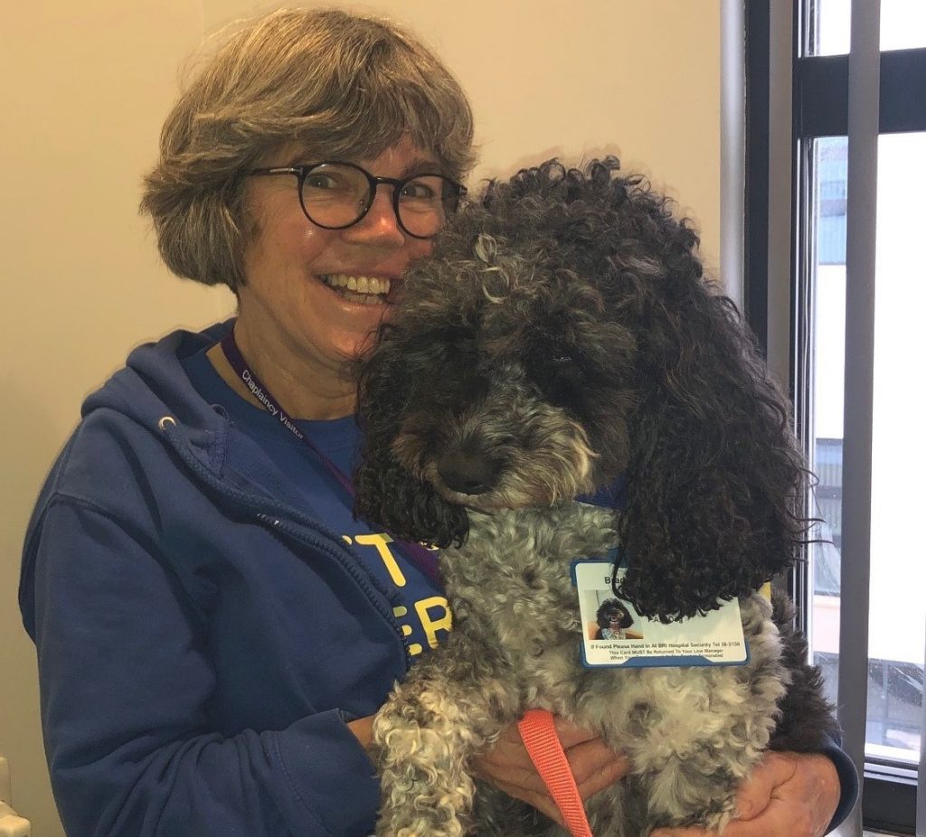 Paw-some therapy dog putting smiles on faces of young hospital patients